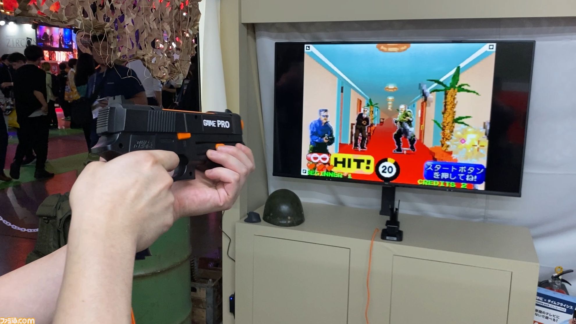 達成電器ブースの新型“G'AIM'E（ジーエイム）”の技術デモを試遊。LITEとPROの2種類で幅広い層に向けていく。汎用ガンコンの開発で令和のガンシューブーム到来が見えた【TGS2026】