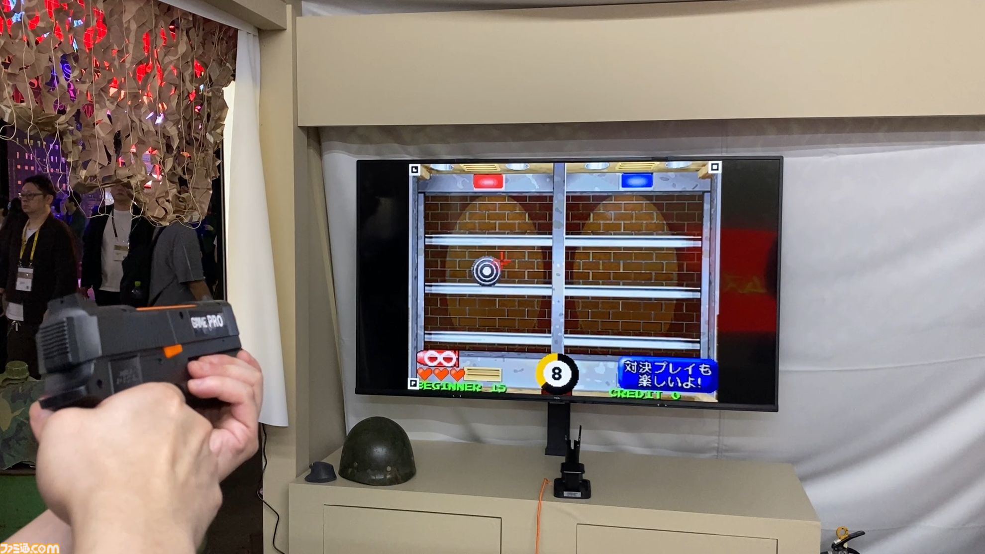 達成電器ブースの新型“G'AIM'E（ジーエイム）”の技術デモを試遊。LITEとPROの2種類で幅広い層に向けていく。汎用ガンコンの開発で令和のガンシューブーム到来が見えた【TGS2026】