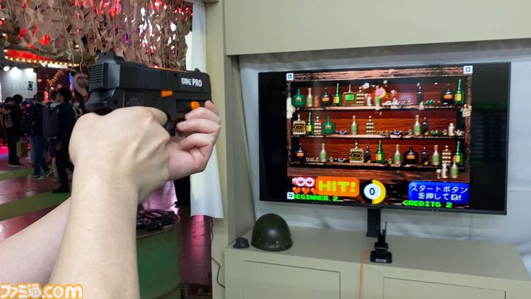達成電器ブースの新型“G'AIM'E(ジーエイム)”の技術デモを試遊。LITEとPROの2種類で幅広い層に向けていく。汎用ガンコンの開発で令和のガンシューブーム到来が見えた【TGS2026】